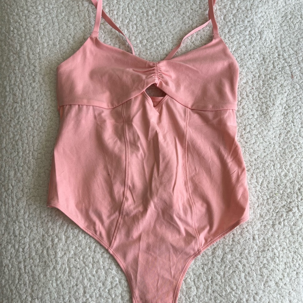 Pink bodysuit with cutout designs